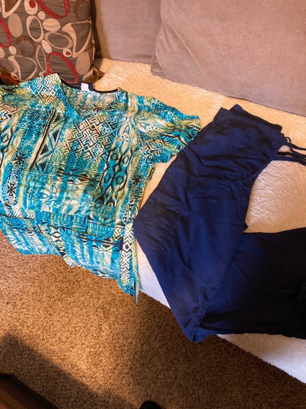 Vibrant Teal Patterned Top with Navy Pants
